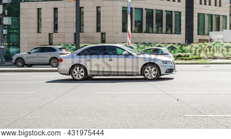 Audi A4 B8 Sedan Is Driving Along The Street In City With Blurred Background. Moscow, Russia - Augus