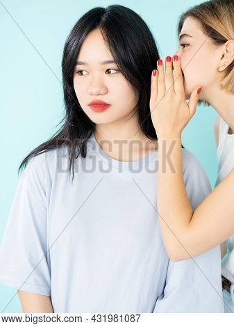 Teenager Gossip. Female Secrets. Spreading Rumors. Conspirator Asian Caucasian Young Women Sharing I