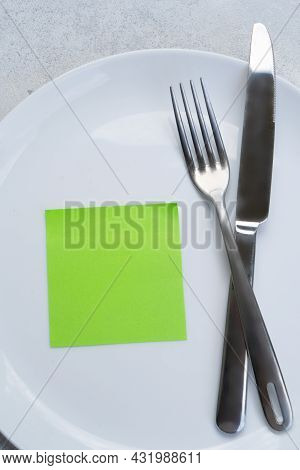 Intermitted Farsting Diet Concept - Empty Plate With Fork And Knife
