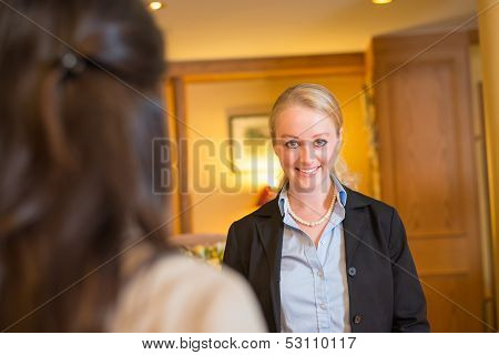 Beautiful blond hotel receptionist