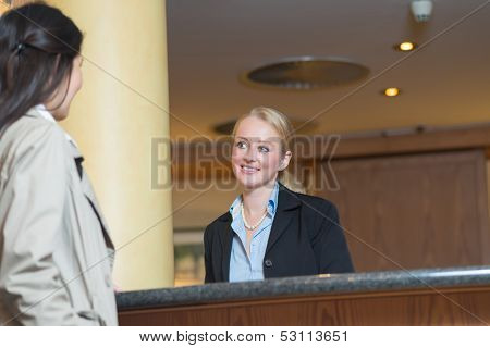 Beautiful blond hotel receptionist