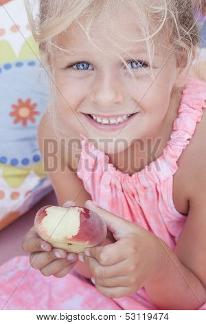 Child Eating A Flat Peach