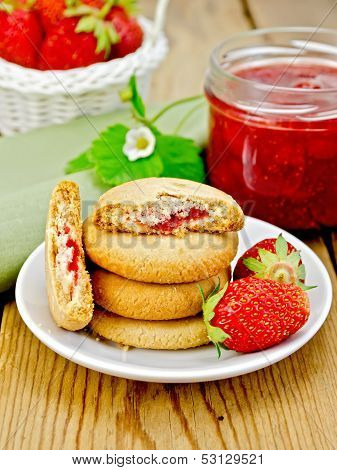 Biscuits With Strawberries And A Basket On The Board