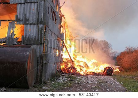 Burning farm with 1000 tons hay in village.