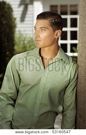Natural fashion portrait of a good-looking young man outdoors