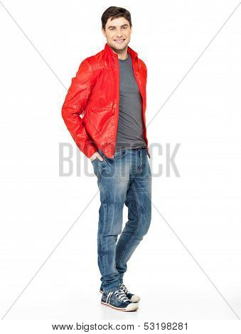 Smiling Happy Man In Red Jacket, Blue Jeans And Gymshoes.