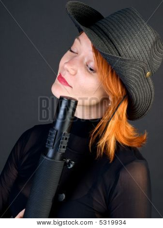 Woman Looking Down A Barrel