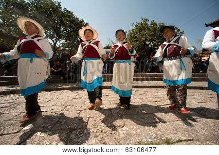 Chinese Naxi Old Woman Performing A Dance.