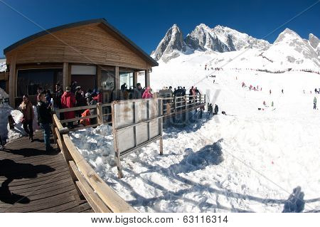 Groups Of Traveler On Wooden Stair Of Jade Dragon Snow Mountain,lijiang,yunnan,southwestern China.