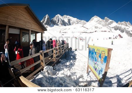 Groups Of Traveler On Wooden Stair Of Jade Dragon Snow Mountain,lijiang,yunnan,southwestern China.