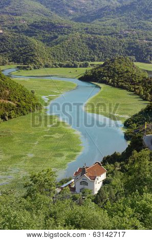 the meandering channel of River Crnojevica in Lake Skadar National Park, Montenegro 