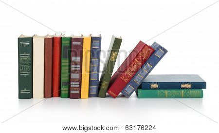 vintage books in a row, isolated on white background, empty labels with free copy space