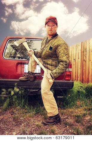 a redneck man with an ax in his hands done with a warm filter