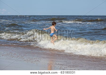 Boy Chasing A Waves