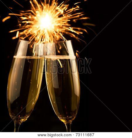 Beautiful golden champagne with sparklers on black background - square