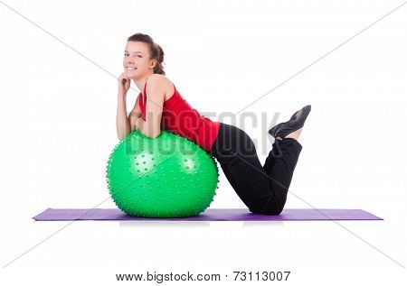 Young woman exercising with swiss ball