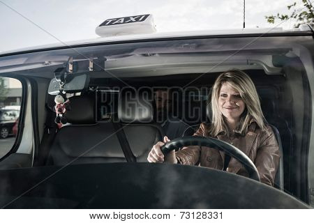 Female taxi driver with passenger