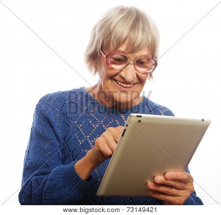 Senior happy woman using ipad isolated on white background 