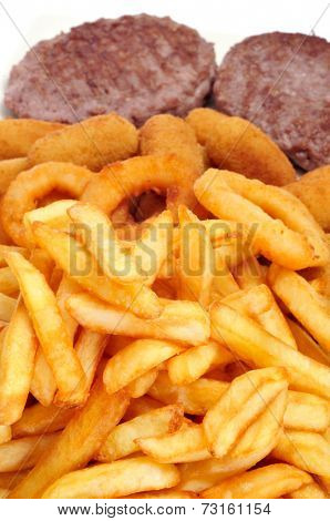 closeup of a spanish combo platter with burgers, croquettes, calamares and french fries