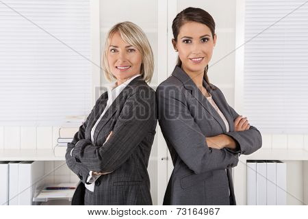 Team Portrait: Successful business woman making career in management positions.