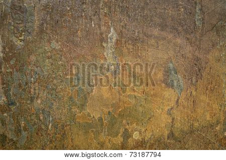 flat, multi color foliated slate rock with abstract like landscape pattern