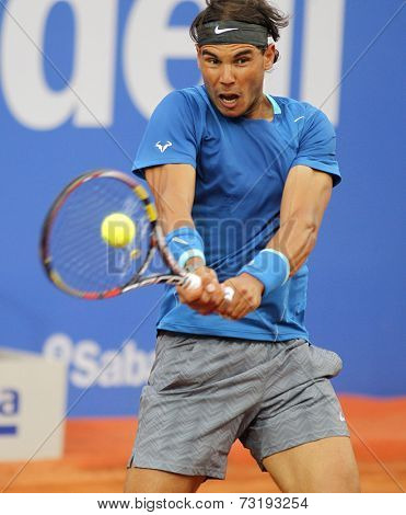 BARCELONA - APRIL, 24: Spanish tennis player Rafa Nadal in action during a match of Barcelona tennis tournament Conde de Godo on April 24, 2014 in Barcelona