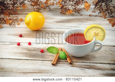 Cup of tea with cranberry and lemon