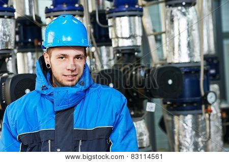 industrial construction worker plumber  at boiler room