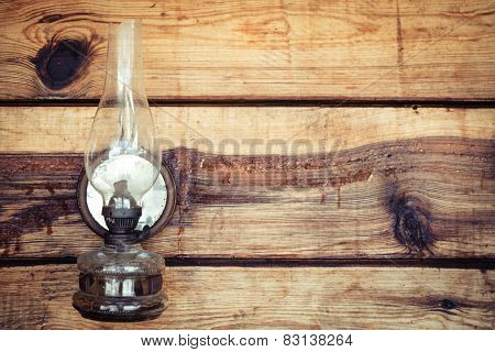 Paraffin Lamp On Wooden Wall