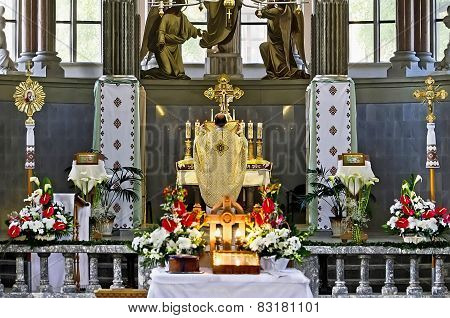 Priest Conducts Worship
