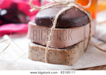 Closeup Of Three Of Natural Handmade Soap. Chocolate, Orange And Scrub Soaps