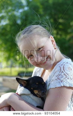 Portrait of a young girl with dog
