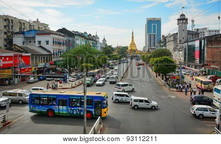Traffic, People, And Buildings In Downtown Yangon