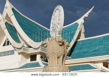 Lion Statue And Wheel Of The Law In Front Of Buddhist Church