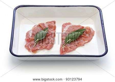 saltimbocca ingredients ( veal, prosciutto and sage) on butcher tray