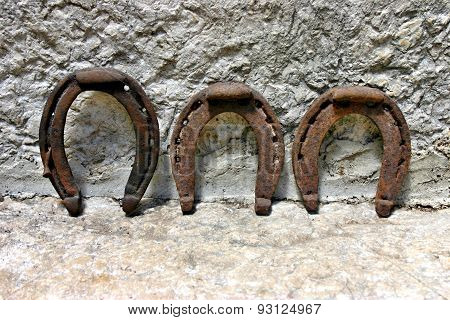 Three rusty horseshoes