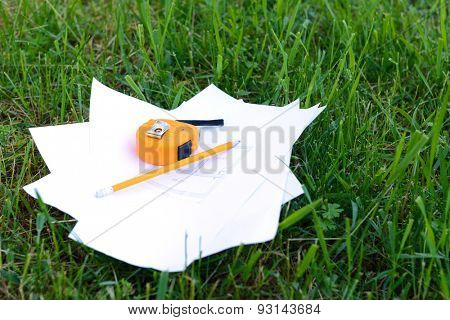 Drawings with pencil and roulette on green grass