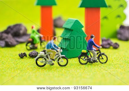 Image Group Of People(mini Figure) With Retro Bicycle In A Park - Outdoor Portrait