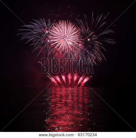 Colorful Fireworks With Reflection On Lake.