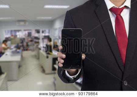 Businessman  Using Mobile Smart Phone On Office Background