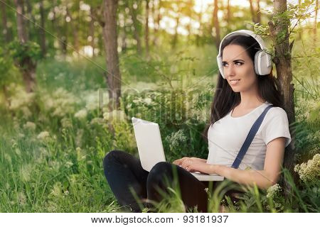Girl with Headphones and Laptop