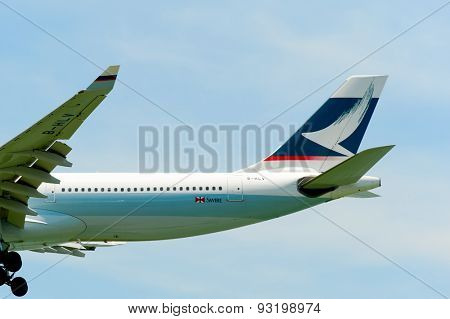 HONG KONG - JUNE 04, 2015: Cathay Pacific aircraft landing. Cathay Pacific is the flag carrier airline of Hong Kong, with its head office and main hub located at Hong Kong International Airport
