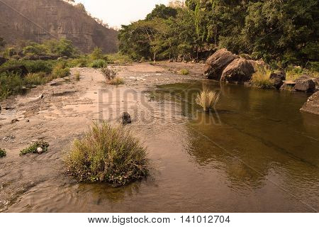 Da Nhim river near pongour vietnam in dry season with rock on the bottom of the stream
