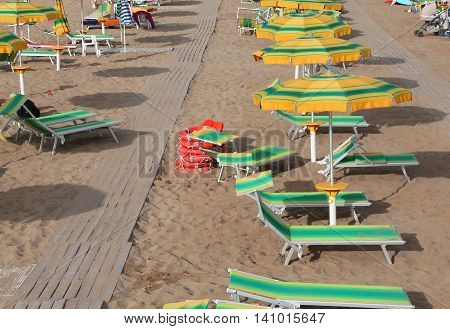 Umbrellas In Sandy Beach Seen From Above