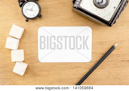 Wooden Table Top With Blank Paper Card,alarm Clock,wood Cube Pencil And Vintage Camera, Template Moc