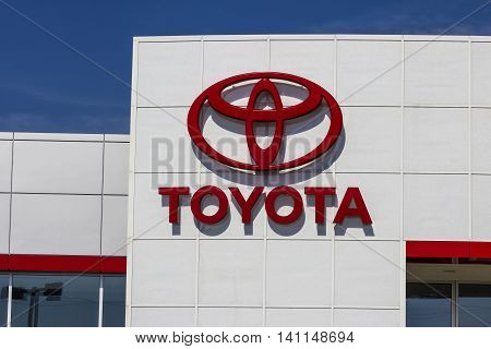 Muncie IN - Circa July 2016: A Local Toyota Car and SUV Dealership. Toyota is a Japanese Automaker Headquartered in Toyota Aichi Japan I