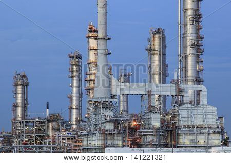 oil refinery palnt against dusky blue sky in petrochemical industry estate