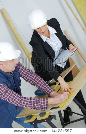 experienced female worker supervising her apprentice
