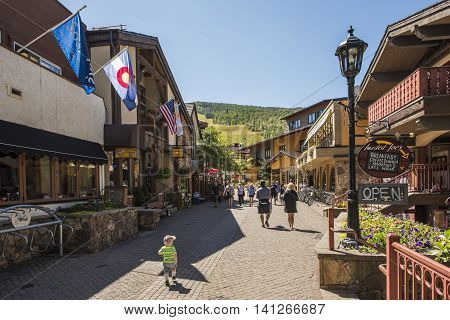 Vail, USA - September 10, 2015: Street in Swiss style at resort town of Colorado with people