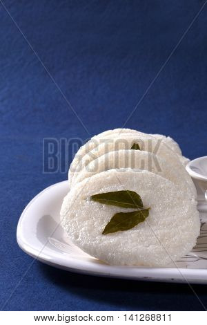 South indian cuisine vegetarian breakfast rava idli or idly in a plate.